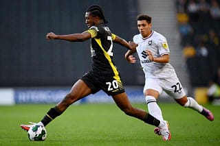 Attacker Josh Neufville on the ball for Sutton United against MK Dons in midweek