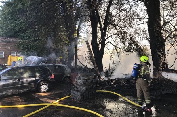 Firefighters tackle caravan and cars blaze on wasteland in Bedford